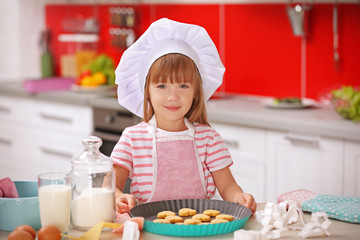 Poster - Little girl cooking in the kitchen