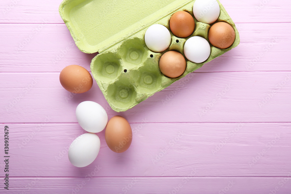 Eggs package on wooden background