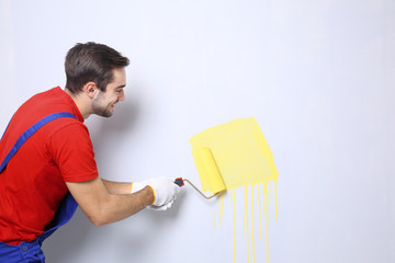 Sticker - Young worker painting wall in room