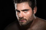 Fototapeta  - Intense determined motivational stare of conviction in eyes from masculine male athlete