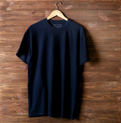 Blank black t-shirt against wooden background