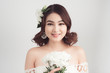© makistock - Beautiful asian woman bride on grey background. Closeup portrait