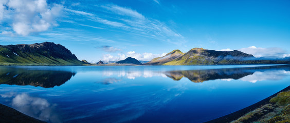 Wall Mural - panoramic picture of Alftavatn Lake coast with mountain reflection at the sunrise, Iceland.