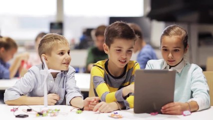 Wall Mural - kids with tablet pc programming at robotics school