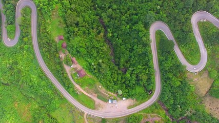 Wall Mural - Aerial view of crooked path of road on the mountain