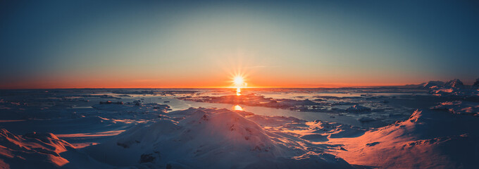 Wall Mural - summer sunset in antarctica. beautiful winter background