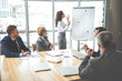 © Yakobchuk Olena - Concentrated employees are co-working in office