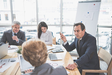 Canvas Print - Group of successful people at briefing