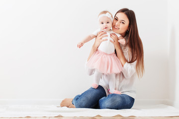 Wall Mural - happy family mother and baby daughter