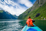 Fototapeta  - Woman kayaker at Geirngerfjord, Norway.