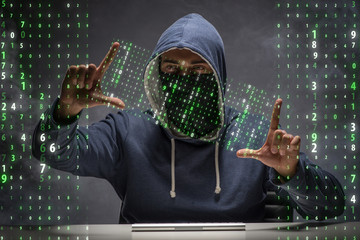 Young hacker in data security concept