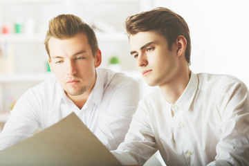 Wall Mural - Handsome gentlemen doing paperwork