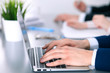 © rogerphoto - Group of business people working together in office