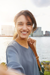 attractive young woman talking selfie and smiling