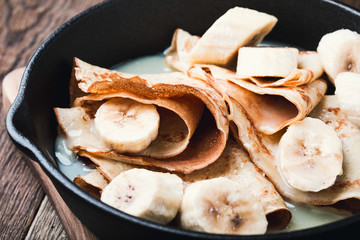 Canvas Print - Crepes with bananas and  cream caramel sauce