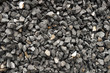 coarse aggregate - a stack of gravel / grit crushed and broken at a stone pit. The colors, sizes and shapes are very irregular.