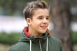 © Africa Studio - Portrait of cheerful teenager outdoors on blurred background, closeup