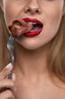 © puhhha - Woman Eating Food. Closeup Of Girl's Face Biting Meat Steak