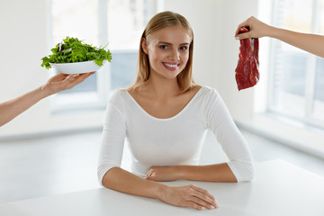 Wall Mural - Healthy Beautiful Woman Choosing Between Meat And Salad