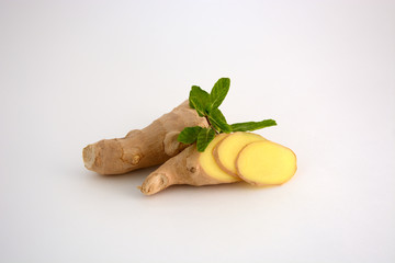 Slices of ginger root wiht the mint sprig