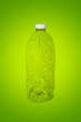 Squashed plastic bottle isolated on white background (recycle concept)
