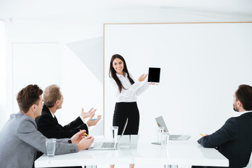 Wall Mural - Woman showing blank tablet computer screen