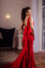 Young Lady In A Gorgeous Red Evening Dress In Interior