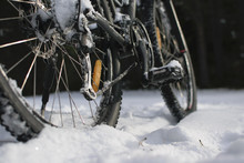 Bicycle Last Wheel With The Brake Rotor In Focus, In The Snow At