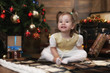 © alexkich - night before Christmas little baby sitting on the floor and play