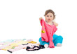 © azazello - Charming baby playing with clothes, isolated on white background