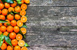 Fresh mandarin oranges fruit on wooden table