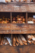 © Dominic Perri - Assortment of whole loaves in wooden shelving