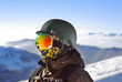 © Krafla - Portrait of a boy in a protective helmet and snowboard mask agai