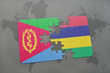 puzzle with the national flag of eritrea and mauritius on a world map
