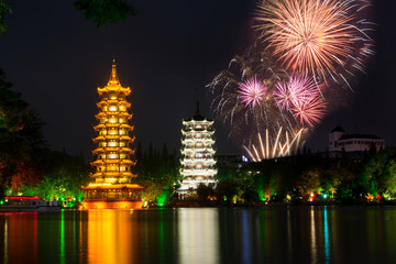 fireworks over two towers of guilin china