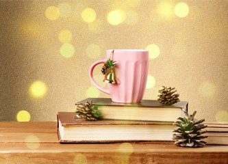 Wall Mural - Christmas tea mug on books.