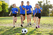 © Africa Studio - Cute kids playing football on field