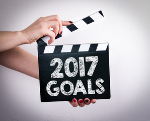 Wall Mural - 2017 goals concept. Female hands holding movie clapper. 