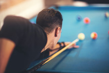 Handsome Man Playing Pool In Pub
