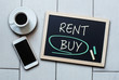 Buy not rent blackboard concept. Choosing buying over renting.