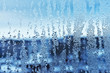 Window glass in the condensate in the cold currents of the water drops background