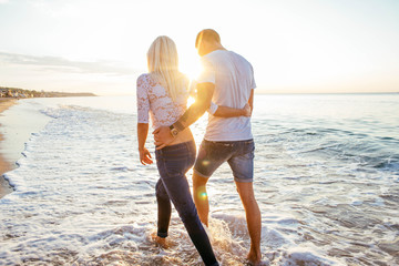 Wall Mural - loving couple on the beach