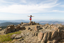 Young Woman Standing On Rock, Looking At View, Silver Star Mountain, Washington, USA