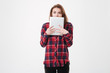 © Drobot Dean - Shocked pretty girl covering her face with tablet pc