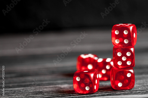 фотография concept luck - dice gambling on dark wooden background