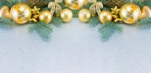 Yellow Christmas Tree Decorations And A Fir Brach