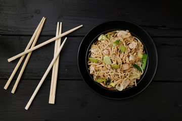 Asian Chow Mein noodles vegetables and tofu top down flat lay