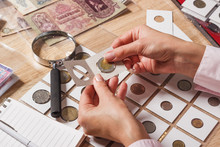 Woman Looks At The Collector S Coin