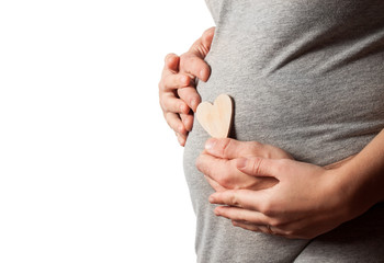 Wall Mural - Image of pregnant woman touching her belly with hands