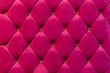 background of shocking pink velvet sofa with crystal button